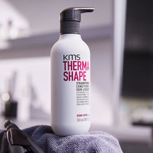 Load image into Gallery viewer, KMS Thermashape Straightening Conditioner deeply nourishes and smooths coarse and unruly hair. Improves manageability and shape during blow-drying. Gradually straightens hair with regular use in combination with a straightening iron. Protects hair from heat, humidity and frizz.