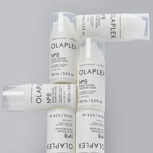 Load image into Gallery viewer, olaplex 8 bond intense moisture mask MOISTURIZES, SMOOTHS, ADDS BODY & SHINE A Multi-Benefit, Reparative Hair Mask Infused with patented OLAPLEX Bond Building technology, this highly concentrated reparative mask adds shine, smoothness & body while providing intense moisture to treat damaged hair. Hair so visibly healthy, you can skip the styling.