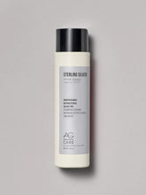 Load image into Gallery viewer, AG Sterling Silver toning shampoo is specially formulated to eliminate brassy, yellow tones from blonde and silver hair. With its unique violet base, this mild toning shampoo removes dullness and brassiness, leaving blonde and silver hair looking cleaner and brighter