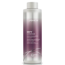 Load image into Gallery viewer, Joico Defy Damage Protective Shampoo is a rich shampoo that helps boost hair with a rich, luxurious lather featuring damage-preventing ingredients, this gentle daily cleanser swiftly sloughs away dirt, impurities, and buildup without roughing up the hair cuticle or stripping vibrant color. The result: shiny, smooth, clean strands—wonderfully resilient and healthy-looking.