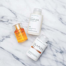 Load image into Gallery viewer, What it is: A leave-in reparative styling cream that eliminates frizz, hydrates, and protects all hair types.  Hair Type: Straight, Wavy, Curly, and Coily  Hair Texture: Fine, Medium, and Thick  Hair Concerns: Dryness, Frizz, and Color Safe