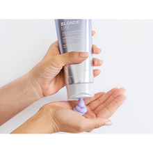 Load image into Gallery viewer, BLONDE LIFE VIOLET CONDITIONER This lightweight, daily conditioner is exclusively formulated to banish yellow tones that can creep into highlighted blonde hair. Offering luxurious slip and detangling power, plus hydration, protection from the elements, and even frizz, our multi-tasking blonde nourisher is stocked with an exotic blend of rich Tamanu and Manoi oils -- perfectly designed to bump up the shine of your icy fair hair.