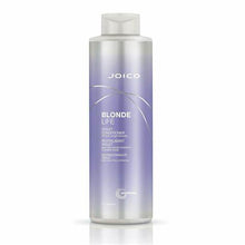 Load image into Gallery viewer, BLONDE LIFE VIOLET CONDITIONER This lightweight, daily conditioner is exclusively formulated to banish yellow tones that can creep into highlighted blonde hair. Offering luxurious slip and detangling power, plus hydration, protection from the elements, and even frizz, our multi-tasking blonde nourisher is stocked with an exotic blend of rich Tamanu and Manoi oils -- perfectly designed to bump up the shine of your icy fair hair.