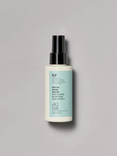 Load image into Gallery viewer, AG Slip Vitamin C Dry Oil Spray . Slip helps hair feel soft to the touch. This vegan, lightweight dry oil spray disperses a fine mist on hair to instantly add smoothness and shine.