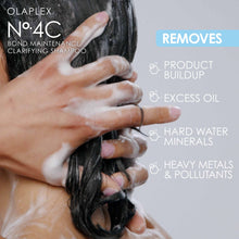 Load image into Gallery viewer, Clarifying System removes damaging product buildup, excess oil, hard water minerals, chlorine, and even heavy metals and pollution. It’s sulfate-free and pH balanced to maintain hydration. OLAPLEX shampoo