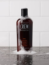 Load image into Gallery viewer, American Crew 3-in-1 Shampoo has a formula with a triple action that acts as a shampoo, a hair and even beard conditioner and as a body wash. In this sense, this product makes the whole bathing process much more practical and faster since with just one product you can make your hair, beard and body cleaner and refreshed.