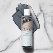 Load image into Gallery viewer, This deep cleansing IGK First Class shampoo gently removes impurities without stripping or drying hair out. Charcoal gently detoxifies, removing build-up and color-dulling residues from dry shampoos, styling products, chlorine, hard water and pollution. Witch Hazel and Tea Tree Oil soothe the scalp. A charcoal clarifying shampoo that gently detoxifies and cleanses, absorbing excess oil and buildup from the scalp, while restoring hair color and shine. Great for straight, wavy, curly and coily hair types