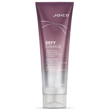 Load image into Gallery viewer, Joico Defy Damage Protective Conditioner replenishes lost moisture, restores softness and boosts hair's resilience against breakage.  Benefits 80% less breakage* 5X stronger hair* You want to maintain over 90% of color vibrancy** See results after the very first use Leaves hair soft, shiny, and healthy Prevents and protects from daily damage Boosts vital moisture Instantly detangles