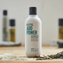 Load image into Gallery viewer, KMS Add Power Shampoo is a lightweight shampoo that prepares fine hair for the rigors of styling. The formula is enriched with rice protein, to strengthen hair from within and improve resilience for more versatile styling, and organic white tea extract, an anti-oxidant, which also improves hair strength and shine.
