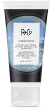 R+Co Glamglow Rinse hair product with blue packaging on a white .
background.
R+Co: SUBMARINE Water Activated Enzyme Exfoliating Shampoo