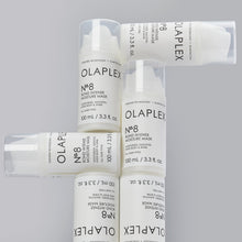 Load image into Gallery viewer, olaplex 8 bond intense moisture mask MOISTURIZES, SMOOTHS, ADDS BODY &amp; SHINE A Multi-Benefit, Reparative Hair Mask Infused with patented OLAPLEX Bond Building technology, this highly concentrated reparative mask adds shine, smoothness &amp; body while providing intense moisture to treat damaged hair. Hair so visibly healthy, you can skip the styling.
