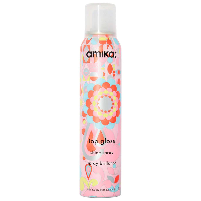 Amika Top Gloss Shine Spray The cherry on top of any style! This lightweight shine spray gives your hair the ultimate glossy + glowy finish. Formulated with UV filters, this finishing mist helps to protect strands—just a few spritzes post styling and voilà! Healthy-looking locks galore. UV protection, vegan and cruelty-free. For all hair types and textures.