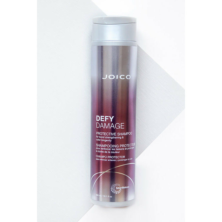 Joico Defy Damage Protective Shampoo is a rich shampoo that helps boost hair with a rich, luxurious lather featuring damage-preventing ingredients, this gentle daily cleanser swiftly sloughs away dirt, impurities, and buildup without roughing up the hair cuticle or stripping vibrant color. The result: shiny, smooth, clean strands—wonderfully resilient and healthy-looking