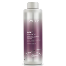 Load image into Gallery viewer, Joico Defy Damage Protective Shampoo is a rich shampoo that helps boost hair with a rich, luxurious lather featuring damage-preventing ingredients, this gentle daily cleanser swiftly sloughs away dirt, impurities, and buildup without roughing up the hair cuticle or stripping vibrant color. The result: shiny, smooth, clean strands—wonderfully resilient and healthy-looking.
