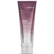 Load image into Gallery viewer, Joico Defy Damage Protective Conditioner replenishes lost moisture, restores softness and boosts hair&#39;s resilience against breakage.  Benefits 80% less breakage* 5X stronger hair* You want to maintain over 90% of color vibrancy** See results after the very first use Leaves hair soft, shiny, and healthy Prevents and protects from daily damage Boosts vital moisture Instantly detangles
